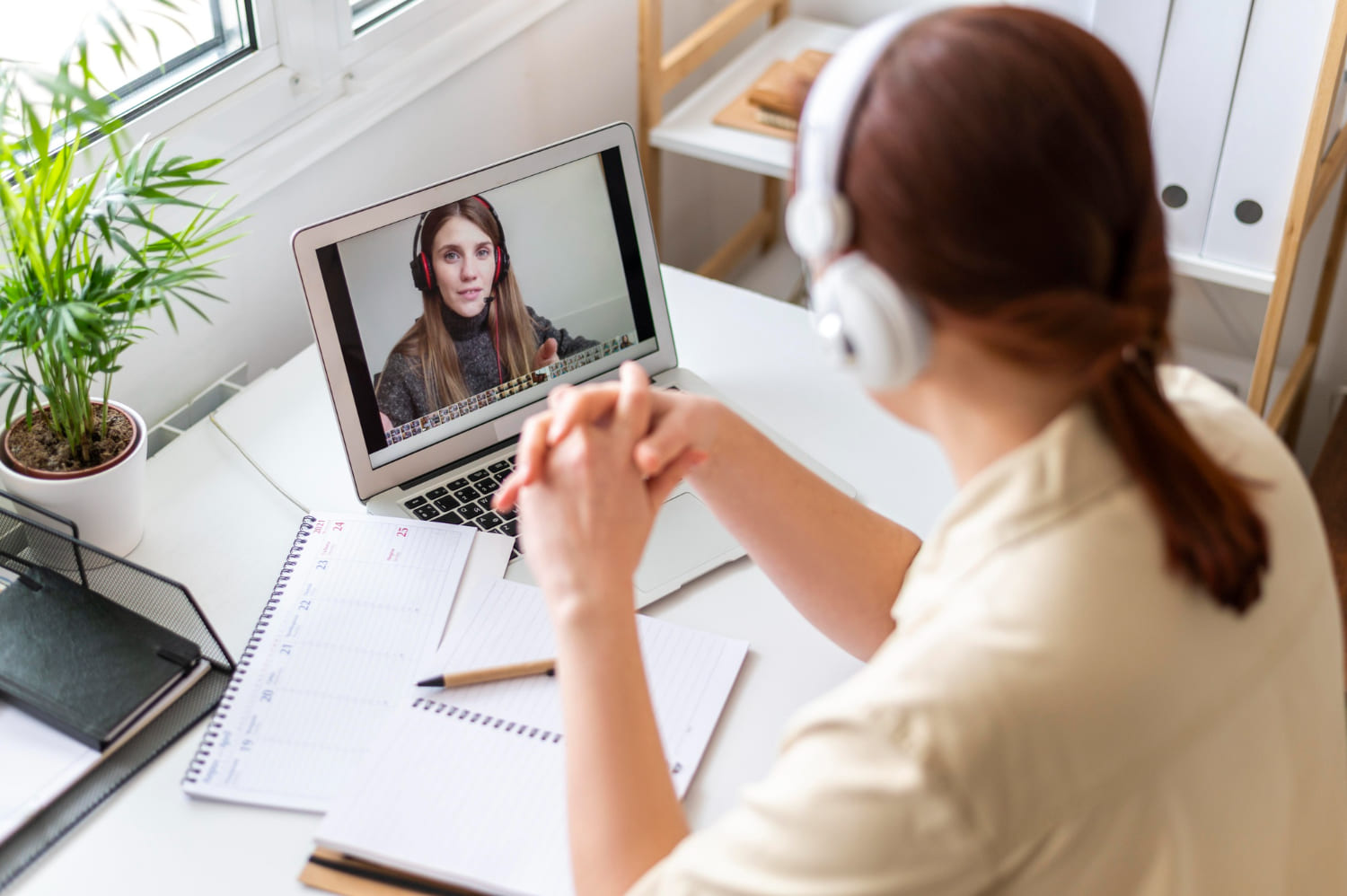 portrait-woman-work-having-video-call-laptop